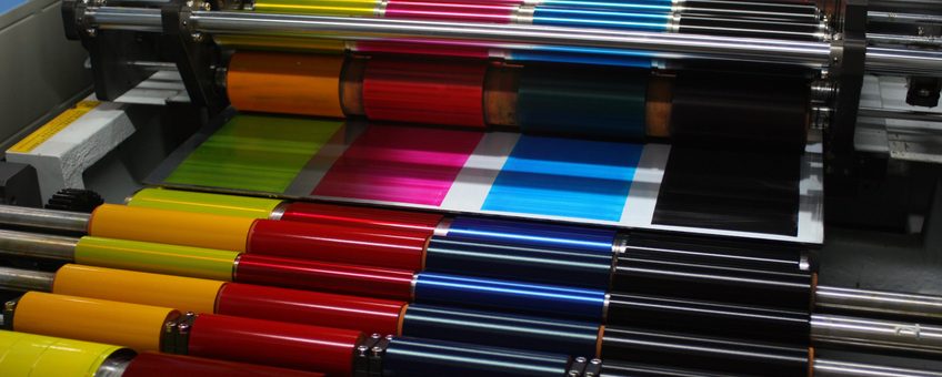 CMYK Ink rollers on an offset printing press